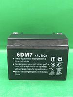 Front view showing model 6DM7 and caution information