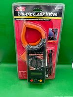 Front view of packaged American Tool Exchange DT266 digital clamp meter