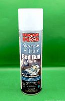 Front view of full aerosol can showing complete label and cap