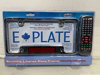 Front of sealed E-Plate scrolling license plate frame showing product and remote in blister package