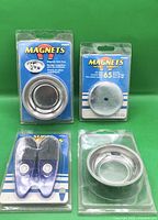 Front view of all four packaged magnetic items