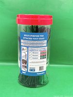 Front view of jar showing ties and lid