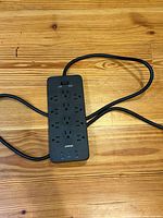 Top view of Anker surge protector showing outlets, USB ports, and cord