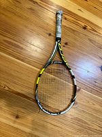 Full view of Babolat racket front side showing frame colour and condition
