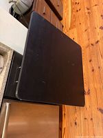 Top view of black laminate rectangular tabletop