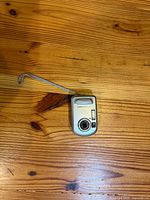 Front view showing lens, flash and branding