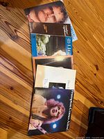 Stack of six LPs showing Peter Frampton and other album covers
