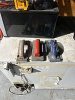 Top view of the three sanding blocks showing handles and mesh pads