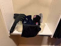 All five winter accessories displayed together in shelf bin