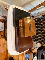 Three stacked storage boxes showing finishes and hardware