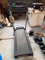 Full view of Weslo treadmill showing console, belt and frame