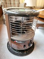 Overall view of cylindrical Aladdin heater with cage and top