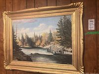 Full view of framed landscape painting