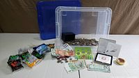 All items overview: bin of coins, banknotes, coin tubes, coin cases