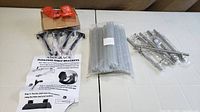 Lot overview: 4 shelf brackets, glue sticks package, 6 drawer pulls