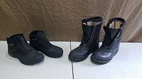 Both pairs of boots side by side