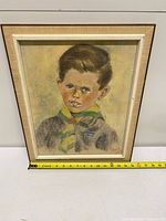 Full view of framed portrait showing entire artwork and frame with measuring tape for scale