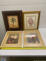 All four framed prints with measuring tape for scale