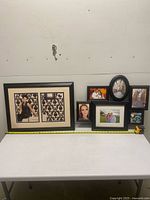 Group shot of both frames on table with measuring tape