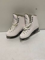 Full view of both skates showing uppers, laces, faux-fur lining, graphics