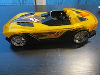 Left side profile showing translucent body, decals, wheels