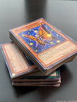 Stack of sleeved Yu-Gi-Oh cards, Swallowtail Butterspy on top