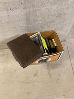 Cardboard box containing mixed media items