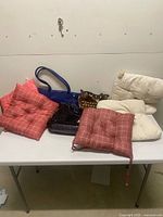 Group shot of all five seat cushions on table