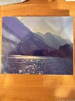 Front view of Christopher Burkett landscape photograph mounted in clear sleeve
