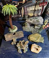 Group of resin aquarium ornaments on table