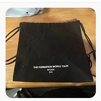 Full view of black drawstring bag
