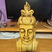 Front view of crackle-glazed ceramic Buddha head