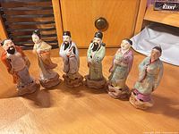 Group of six polychrome glazed porcelain Immortal figurines