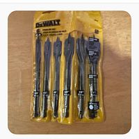 Front of sealed DeWalt blister pack showing six spade bits and size markings