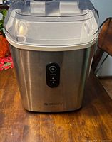 Front view of Ecozy stainless steel nugget ice maker with transparent lid
