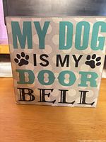 Front view of wooden sign showing text and graphics