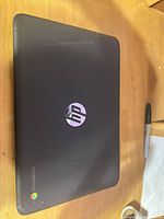Closed HP Chromebook showing lid and Chrome logo