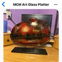Front view of art glass platter on stand