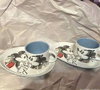 Full view of both mugs and plates on wrapping