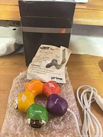 Hub, box, leaflet and cable on table