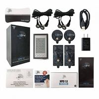 Full kit layout showing device, pads, cables, adapter, manuals