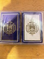 Front view of both sealed decks in plastic case