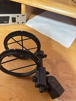 Overall view of black plastic shock mount on tabletop