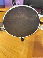 front view of circular pop filter showing mesh and frame