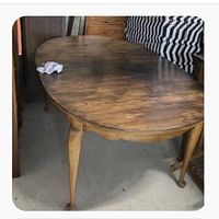 Oval wooden dining table cabriole legs pad feet