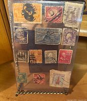 Front view of 13 stamps mounted in 4x6 frame