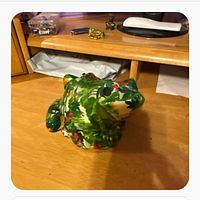 Front view of floral Talavera ceramic frog figurine