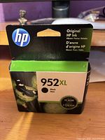 Front view of sealed HP 952XL black ink cartridge box