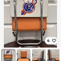 Front view of folded stadium seat showing Broncos logo and orange cushion