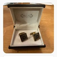Open presentation box displaying both cufflinks